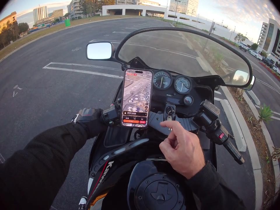 Satellite map view in RiderShield on a phone mounted to a parked motorcycle.