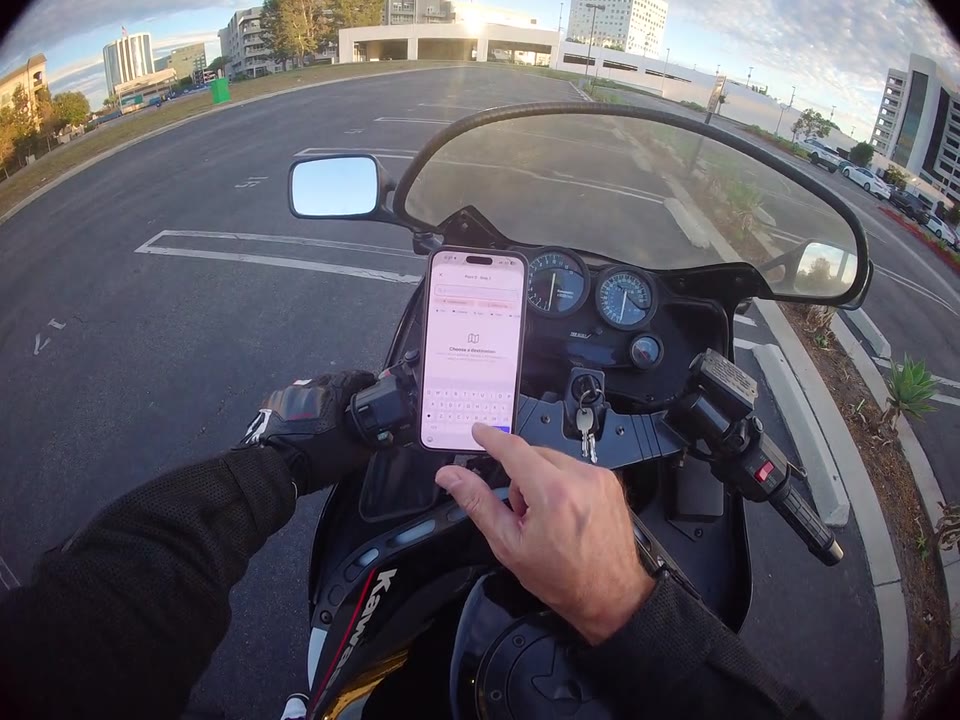 RiderShield route planning on a motorcycle-mounted phone before departure.